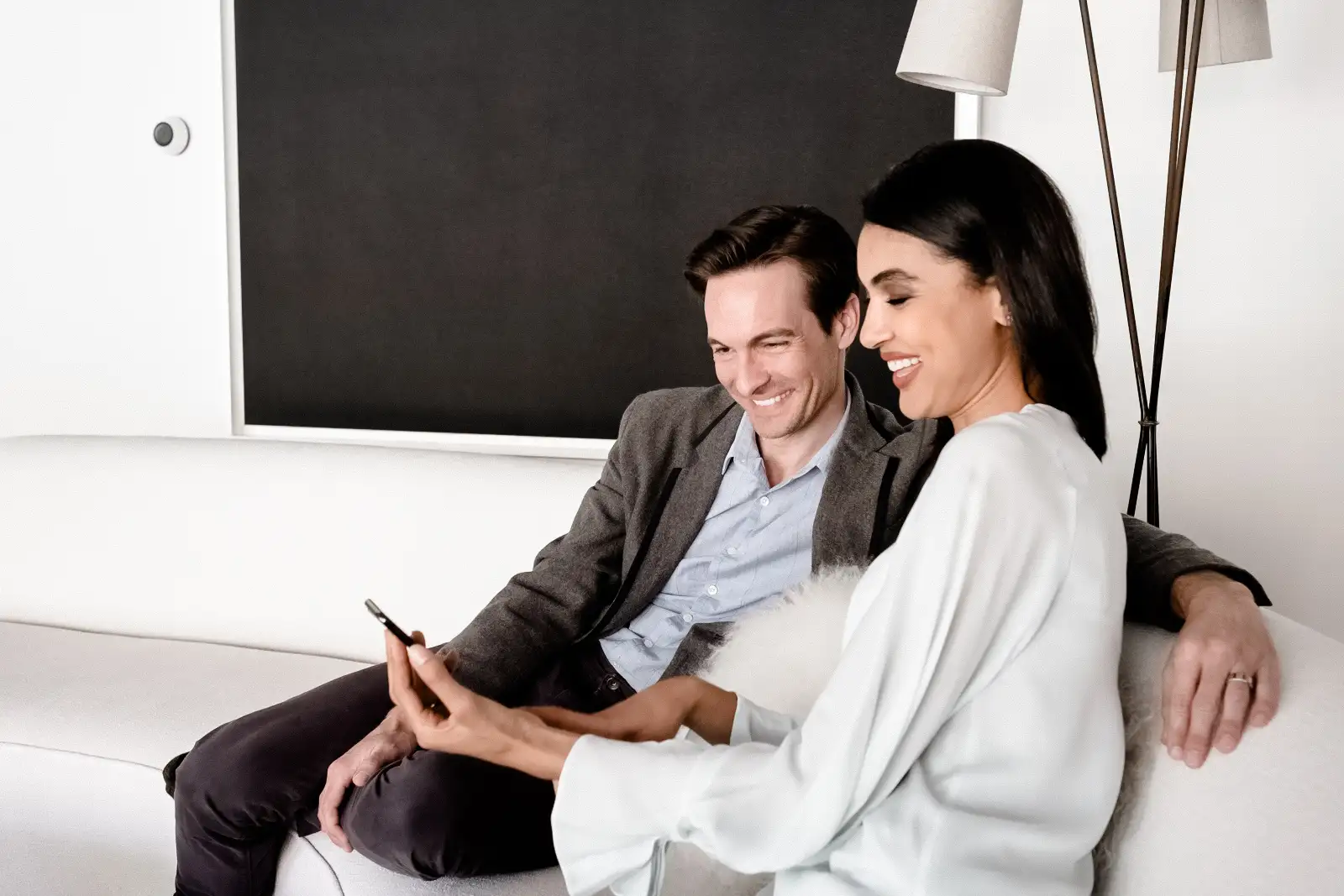 couple looking at smart home app